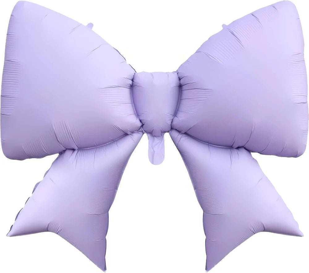 Large purple inflatable bow on a white background