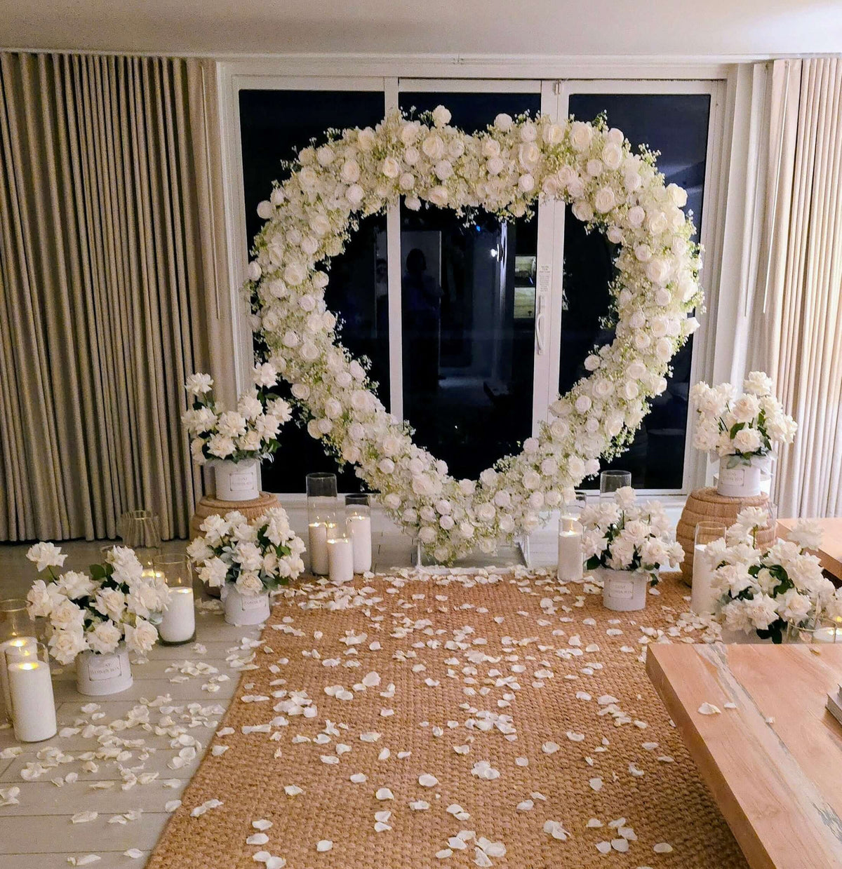 heart arch marriage proposal decorations with white flowers and candles, perfect for romantic events.